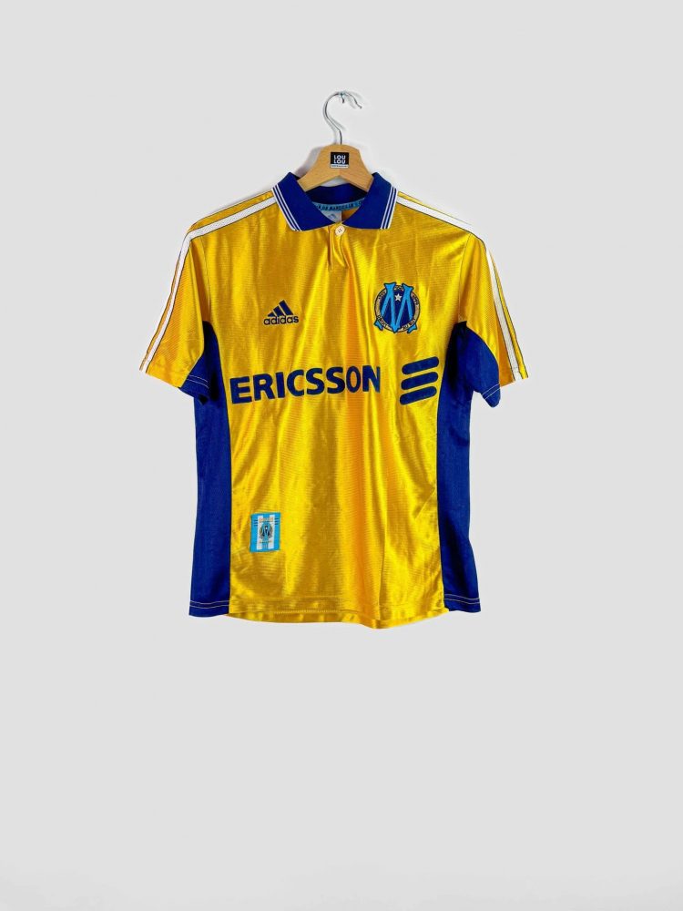 Maillot domicile Olympique de Marseille 1998-1999 Adidas, coloris jaune et bleu avec sponsor Ericsson.