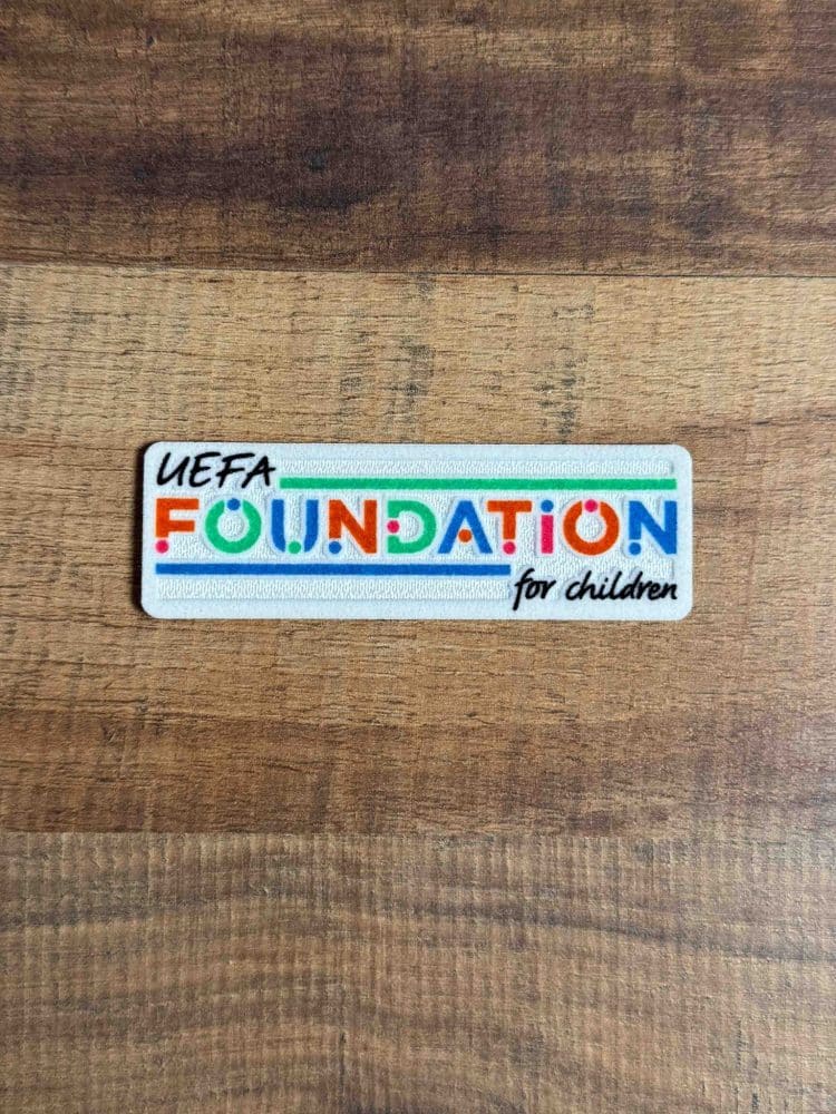 Badge UEFA Foundation for Children officiel porté par les joueurs en Ligue des Champions, patch à coudre pour maillot de football authentique