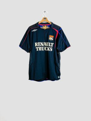 Maillot Olympique Lyonnais noir 2005-2006 sur cintre, détail finitions rouge et bleu royal